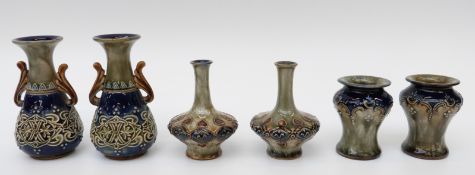 Two pairs of small Doulton Lambeth vases and a similar Royal Doulton pair,