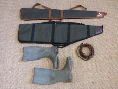 Two gun slips, a leather cartridge belt and a pair of wellies.