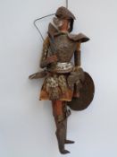 An early 20thC Japanese style tin and wooden marionette puppet with ceramic head,