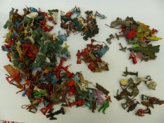 A large collection of lead and plastic cowboy and Indian figures