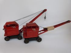 Two Tri-ang pressed steel Jones KL Cranes with red body and black bases