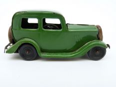 Tri-ang Minic clockwork tinplate Ford Saloon with green body and black wheels