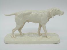 A Nymphenburg porcelain figure of a pointer with impressed J Mene to base and inscribed no 504,