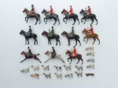 Twenty-seven Britains lead model hunting figures and animals comprising eleven huntsmen and women,