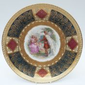 A Vienna style charger decorated with a classical scene, initialled JNH,