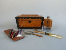 A tea caddy, pens, hip flask,