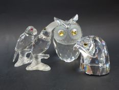 Four Swarovski Crystal birds comprising two stylised owls, a toucan and a parrot,