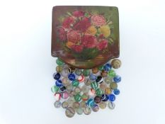 Fifty-six various glass marbles including some with multi-coloured latticino swirls,