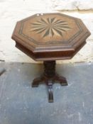 A 19thC oak octagonal occasional table with starburst inlaid decoration to top,