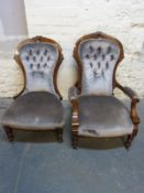 A Victorian King and Queen pair of upholstered button back mahogany chairs