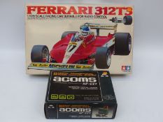 Tamiya 1:10 scale model kit Ferrari 312T3 A1001 with Acoms remote control, both in original boxes.