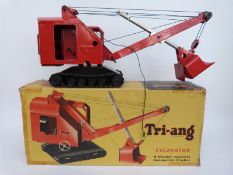 Tri-ang pressed steel excavator with red body, black base and black tracks,