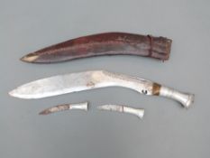 Kukri knife decorated metal handle, leather covered wooden sheath together with karda and chakmak,