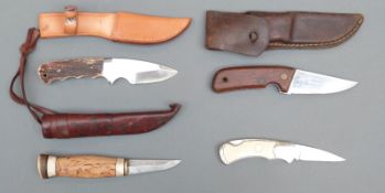 Four various hunting and similar knives including a Finnish example with signed blade,
