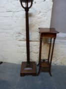 A reeded mahogany torchere and a four pillar plant stand