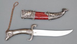 An Ovis AmmonSteel fixed blade dagger and sheath with ram and ram's head decoration,