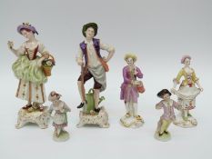 A collection of German porcelain figures including Saxe and Dresden