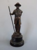 A bronze figure of a Scout, plaque to base,