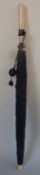 An ivory handled parasol