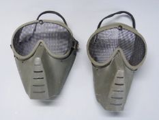 Two airsoft masks and a Marui BB speed loading tool.