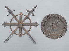 Cast iron crossed swords and shield wall plaques,