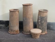 Three various chimney pots and cover