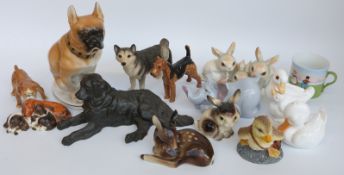 A group of various ceramic animal figures to include Royal Doulton Airedale, Royal Osborne, Nao,