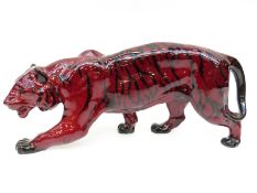Royal Doulton flambé figure of a stalking tiger, stamp to front paw,