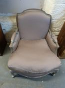 A French style armchair raised on cabriole legs