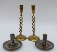 A pair of trench art candlesticks by repute made from old Spitfire parts,