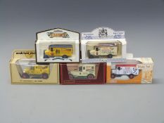 Five Matchbox and Lledo diecast model vans all featuring shotgun cartridge adverts including Eley