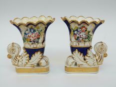 A pair of early 19thC Derby spill vases with applied flower decoration