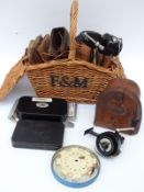 A collection of vintage leather cast wallets including Hardy empty leather reel box,