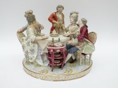 A large German porcelain figural group of two 19thC gentlemen plying two ladies with wine whilst