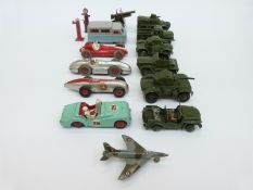 Fifteen Dinky Toys diecast model vehicles including military vehicles, petrol pumps etc.