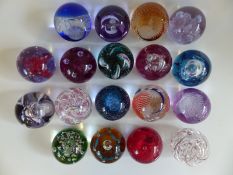 Sixteen Caithness Glass paperweights comprising Quicksilver, Fireball, Myriad, Moonflower, Journey,