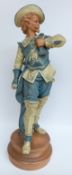 A large 19th/20thC pottery figure of a Cavalier on a terracotta base in Goldscheider style,