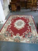 A modern red and cream ground rug