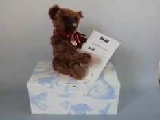 Steiff Teddy Bear Woody with brown tipped mohair, growler, bow and jointed limbs,
