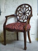 Carver chair with circular carved back