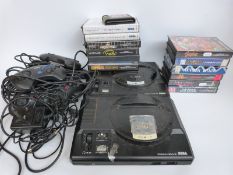 Two Sega Mega Drive games consoles together with various games,