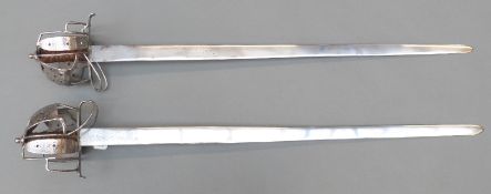 A pair of replica English civil war swords,