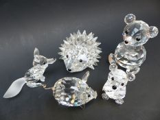 Five Swarovski Crystal animals comprising a hedgehog, two teddy bears, a fox and a pig, largest 6.