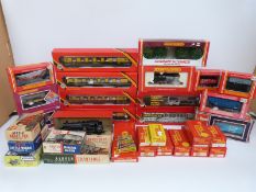 A quantity of Hornby, Tri-ang and Airfix 00 gauge railway goods wagons, including 2-6-2 tank loco,