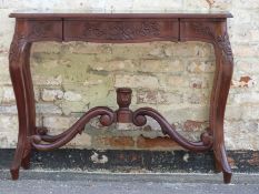 An occasional or side table with shaped legs W106 x D40 x H82cm