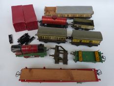 A quantity of Hornby and other 0 gauge rolling stock including three carriages,