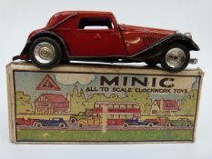 Tri-ang Minic clockwork tinplate Streamline Saloon with red and black body and original key,