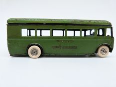 Tri-ang Minic clockwork tinplate London Transport Green Line Dorking bus with green and black body,