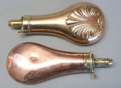 Two copper and brass powder flasks one James Dixon & Sons with embossed decoration 19cm long the