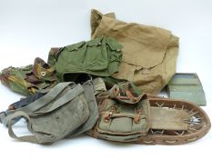 An assortment of military equipment to include webbing and ammunition pouches,